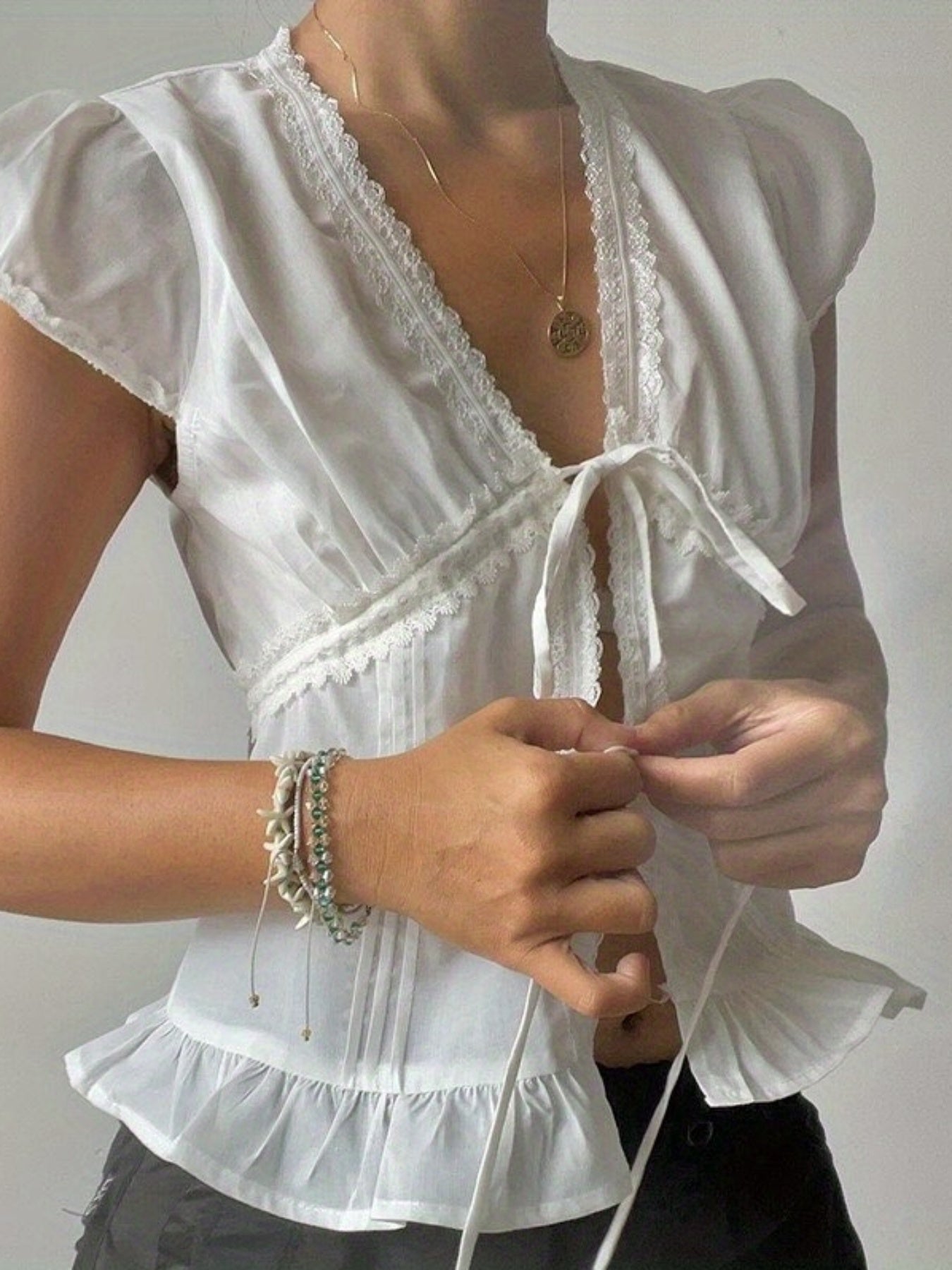 Women'S Casual Lace-Embellished V-Neck Top with Ruffle Hem - Light Blue, Short Sleeve, Summer Blouse with Front Tie Detail, Lace Trim, Non-Padded, Casual Summer Top|Ruffle Hem Top|Lace Trim Detail